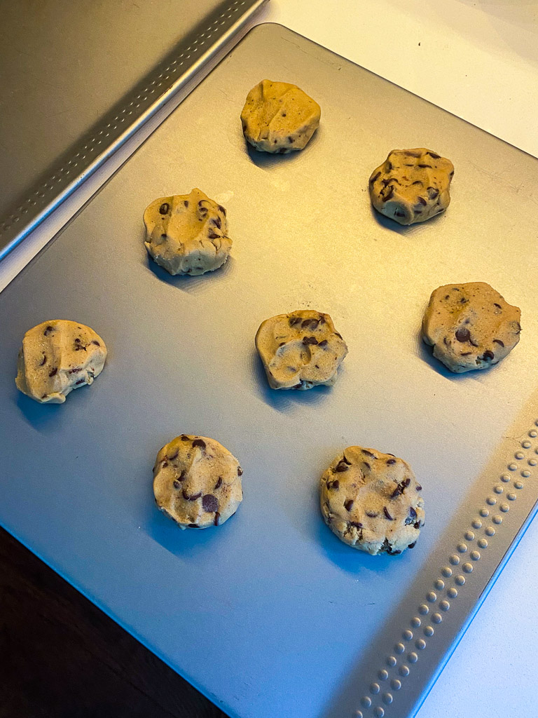 Cookie dough on a baking sheet, ice cream cookie sandwich