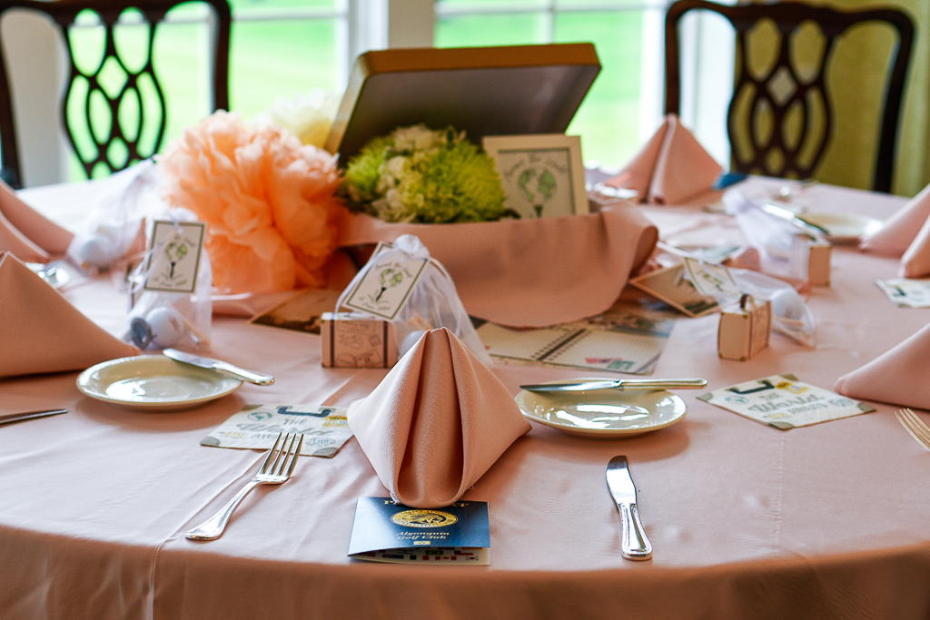 These travel theme party ideas areperfect for a bridal shower, bachelorette party or graduation party. A suitcase centerpiece is a simple travel theme party decor idea that will make pulling your tablescape together a breeze. We added vintage travel postcards and yellow and coral tissue poufs to create more interest. It looks great with these blush table linens.