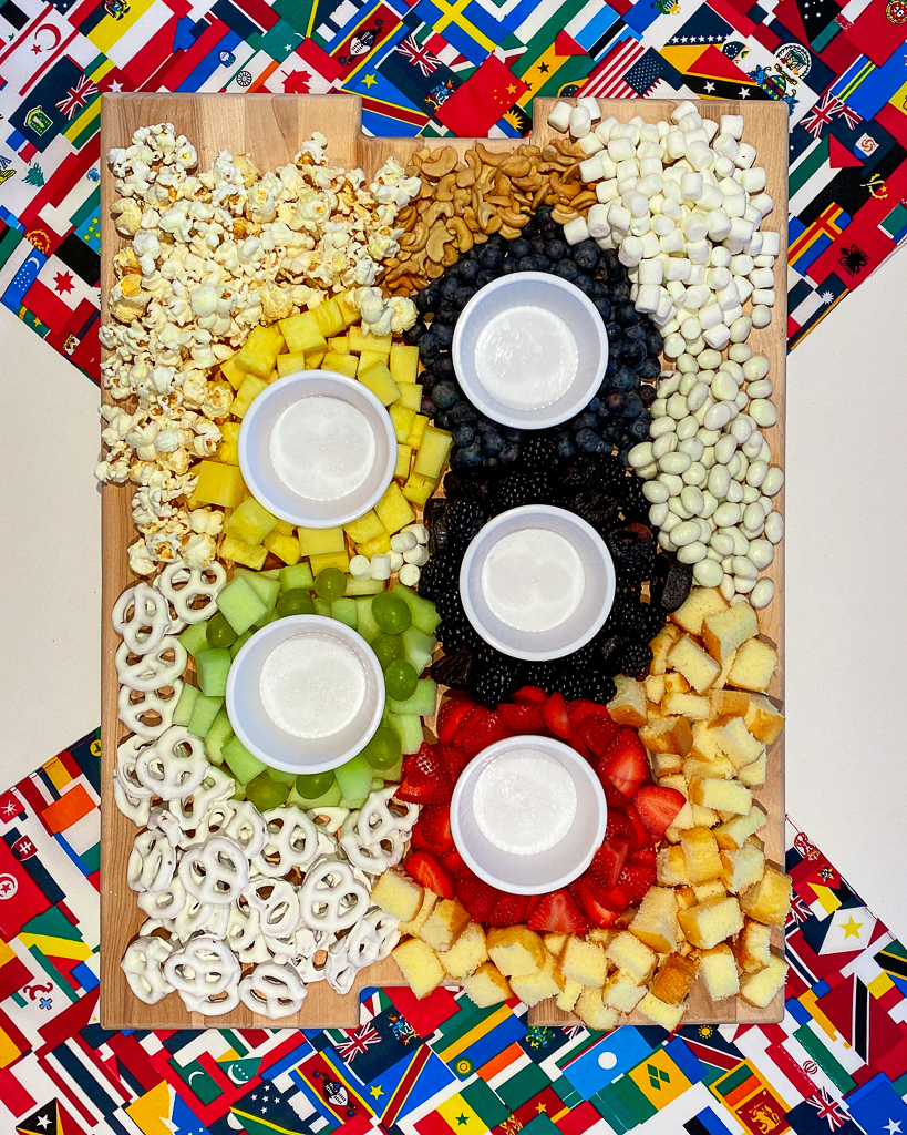 A charcuterie board made from fruit and in the shape of the Olympic rings. Olympic Party Ideas