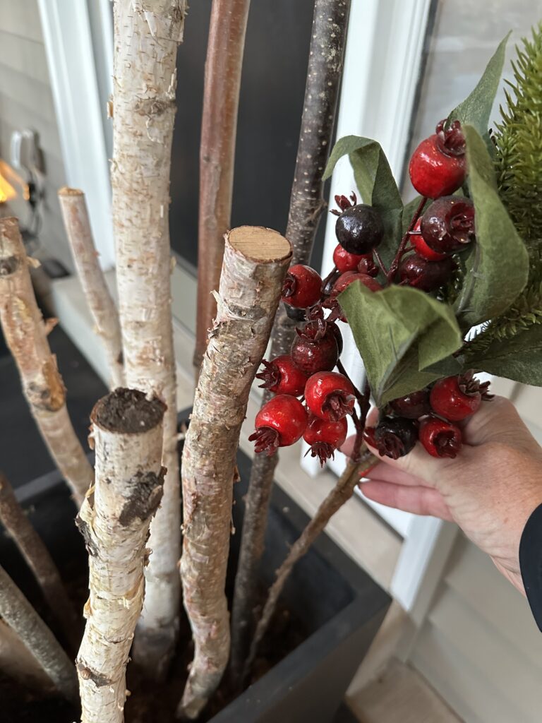  Christmas outdoor planter ideas, DIY Christmas outdoor planter, Christmas planter with birch branches, Outdoor holiday planter tutorial, Winter porch planter ideas, how to make a Christmas planter, birch branch Christmas arrangement, holiday planter with ornaments, outdoor Christmas decor ideas, DIY holiday planter with lights, winter outdoor arrangement, battery operated fairy lights outdoor, festive front porch décor, holiday urn planter ideas, Christmas container gardening