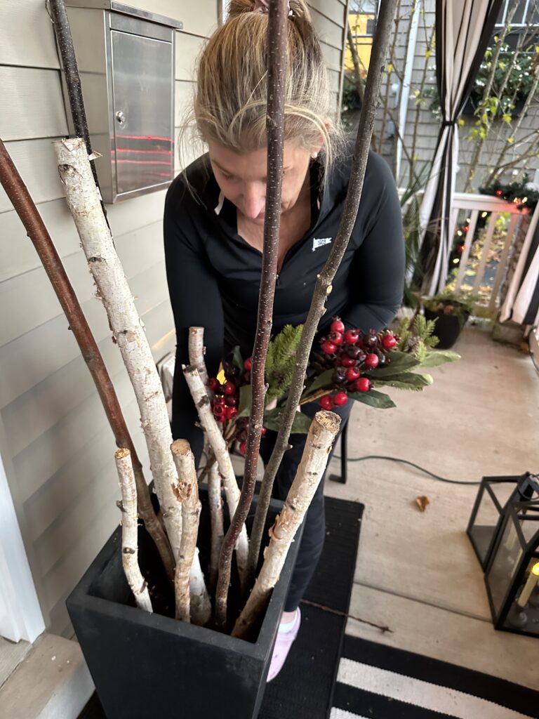 Christmas outdoor planter ideas, DIY Christmas outdoor planter, Christmas planter with birch branches, Outdoor holiday planter tutorial, Winter porch planter ideas, how to make a Christmas planter, birch branch Christmas arrangement, holiday planter with ornaments, outdoor Christmas decor ideas, DIY holiday planter with lights, winter outdoor arrangement, battery operated fairy lights outdoor, festive front porch décor, holiday urn planter ideas, Christmas container gardening