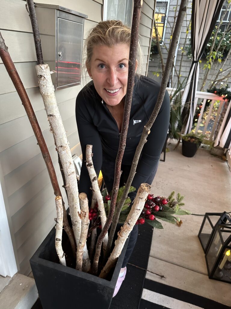 Christmas outdoor planter ideas, DIY Christmas outdoor planter, Christmas planter with birch branches, Outdoor holiday planter tutorial, Winter porch planter ideas, how to make a Christmas planter, birch branch Christmas arrangement, holiday planter with ornaments, outdoor Christmas decor ideas, DIY holiday planter with lights, winter outdoor arrangement, battery operated fairy lights outdoor, festive front porch décor, holiday urn planter ideas, Christmas container gardening