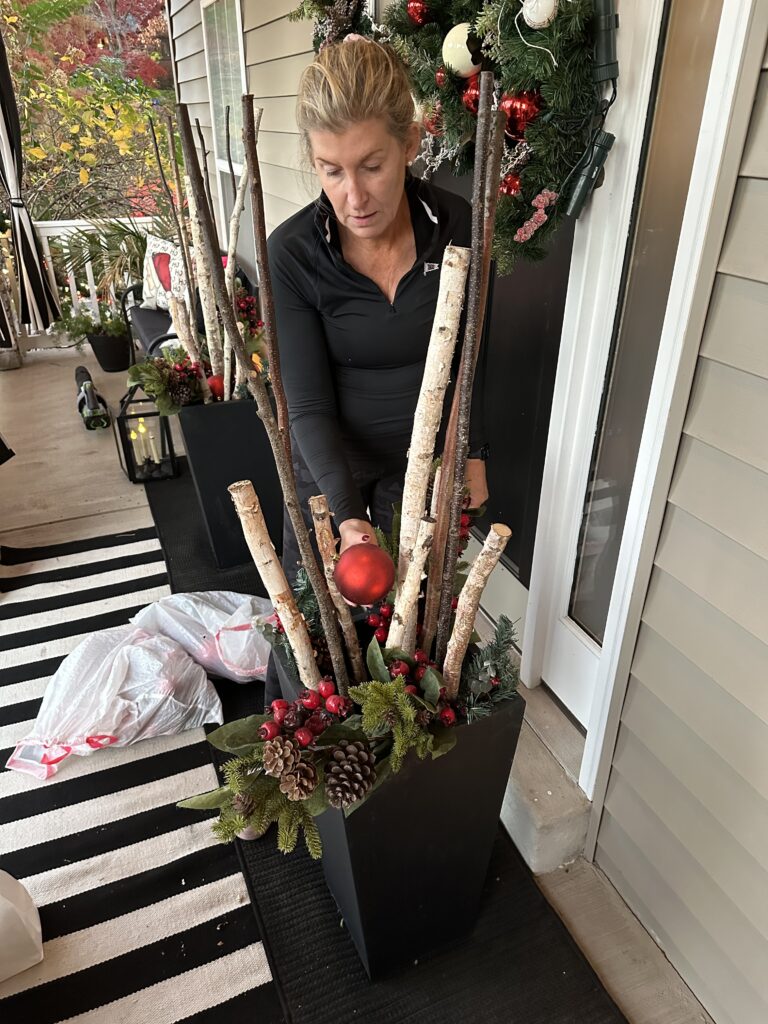 Christmas outdoor planter ideas, DIY Christmas outdoor planter, Christmas planter with birch branches, Outdoor holiday planter tutorial, Winter porch planter ideas, how to make a Christmas planter, birch branch Christmas arrangement, holiday planter with ornaments, outdoor Christmas decor ideas, DIY holiday planter with lights, winter outdoor arrangement, battery operated fairy lights outdoor, festive front porch décor, holiday urn planter ideas, Christmas container gardening